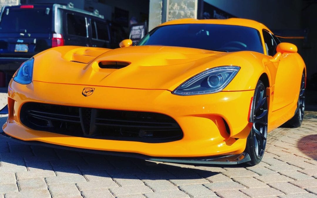 Orange sports car after a detail.